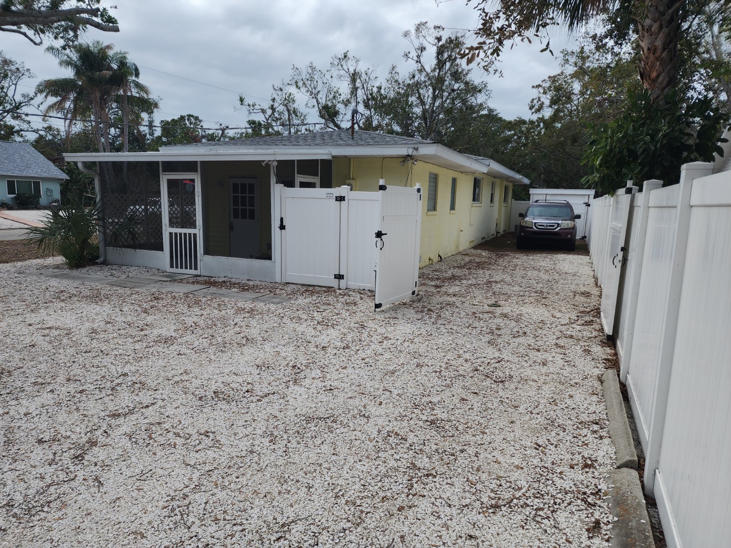 102 - back yard with car